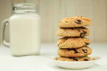 Cookies with milk closeup with space for text, side view