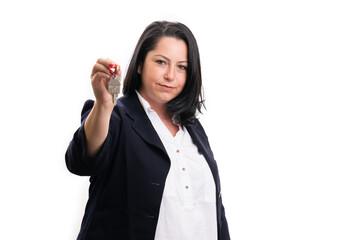 Female real-estate agent presenting house keys with copyspace