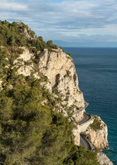 Vertical shot of the rocky Liguria coastline near Noli, Italy