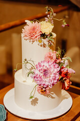 Wedding cake decorated with fresh flowers