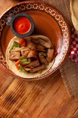 Beef Fajitas Tacos. Alambre de Res. Very popular recipe in Mexico, the main ingredients are pieces of meat, onion, bacon and bell peppers, roasted on the grill, commonly eaten in tacos.