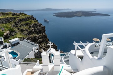Typical white washed greek buildings in Santorini overseeing the caldera in Greece