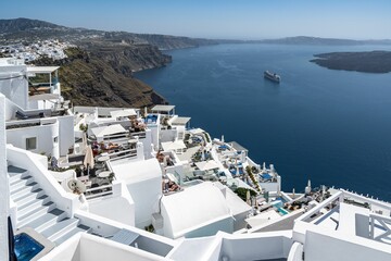 Typical white washed greek buildings in Santorini overseeing the caldera in Greece