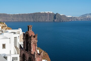 Oia Town in Santorini with  traditional Cycladic houses overlooking the Sea, Greece