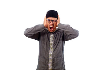 Stressed asian muslim man standing while screaming and covering