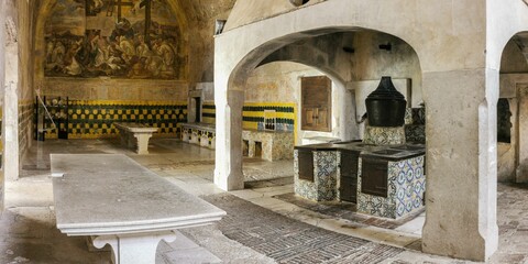 Image of a kitchen with a stone table in Certosa di Padula, Campania, Italy