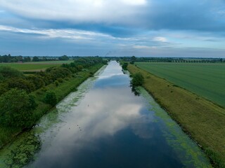 Beautiful reflection of the cloudy sky on the Witham river