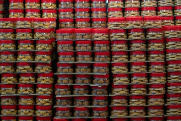 Sierkussen Closeup of Chinese new year cookies in jars © Miguel Vidal/Wirestock Creators