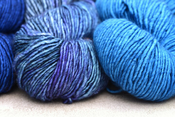 Close up of Turquoise, violet and royal blue yarns