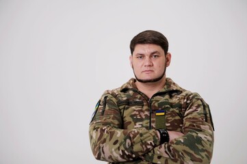 man in military uniform on white background inscription on form of armed forces of Ukraine emblem...