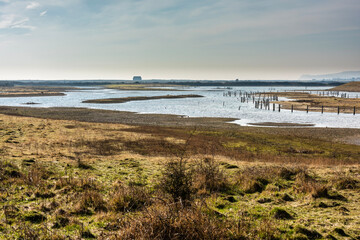 Rye Harbour Nature reserve in East Sussex with the old lifeboat house in the distance