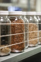 Closeup of jars of bulk loose leaf tea ingredients at a health food store