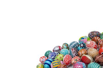 A collection of colorful Easter eggs arranged close together in the lower corner of the frame.