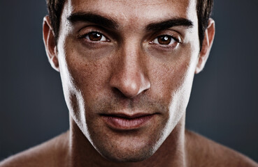 He just oozes confidence. Closeup studio portrait of a handsome young man.