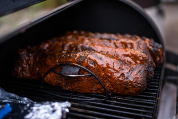 Pieces of meat on a grill