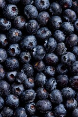 Closeup shot of water drops on blueberries