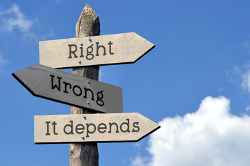 Right, wrong, it depends - wooden signpost with three arrows, sky with clouds