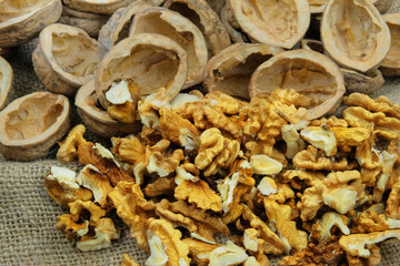 Walnuts on old rustic table. Walnut kernels and walnut shell.