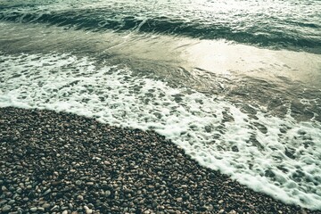 Closeup shot of the sea pebbles on the beach