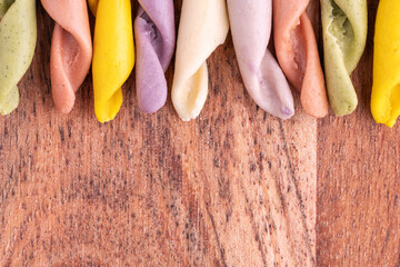 Strozzapreti Pasta, Italian traditional homemade pasta, macro shot, top view. Colorful Pasta, healthy food background.