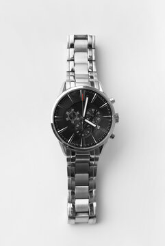 Men's wrist watch on a white background top view.