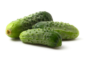 Three fresh cucumbers isolated on a white background. Green cucumbers.