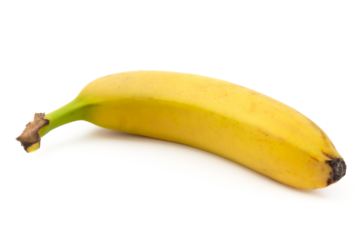 Close-up of one banana lying isolated on white background.