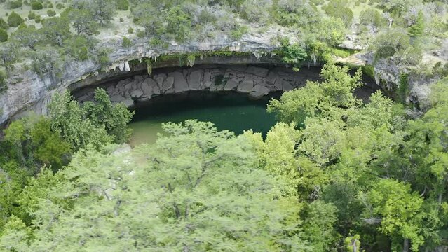 Aerial view of Hamilton Pool landscape during spring season in Texas Hill country nature preserve - 4K Drone