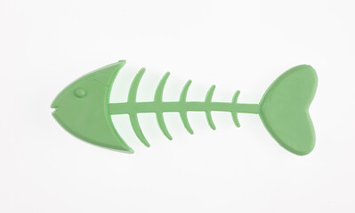 plastic fish bone toy isolated on white background