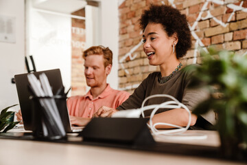 Two colleagues working together in office