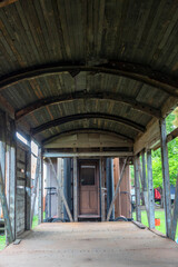 old abandoned wooden railway carriage from inside