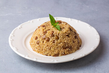 Traditional delicious Turkish foods; bulgur pilaf with green lentils (Turkish name; yesil mercimekli bulgur pilavi)