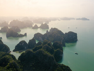 Aerial view floating fishing village and rock island, Ha Long Bay, Vietnam, Southeast Asia. UNESCO...