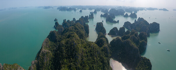 Aerial view floating fishing village and rock island, Ha Long Bay, Vietnam, Southeast Asia. UNESCO World Heritage Site. Junk boat cruise to Ha Long Bay © CravenA