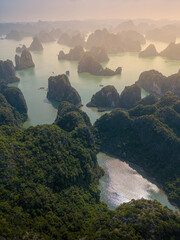 Aerial view floating fishing village and rock island, Ha Long Bay, Vietnam, Southeast Asia. UNESCO...