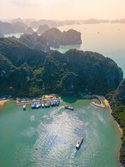Aerial view floating fishing village and rock island, Ha Long Bay, Vietnam, Southeast Asia. UNESCO...
