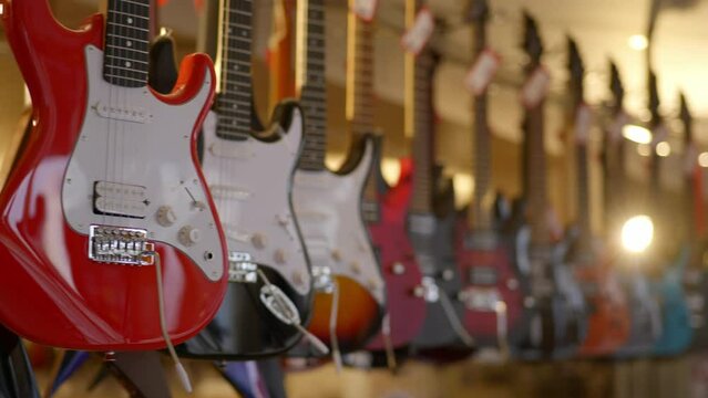 a lot of vintage electric guitars in the interior of a music store