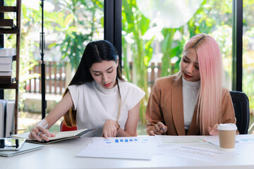 Businesswoman Consulting meeting working and brainstorming new business project finance investment concept. Business team analyzing income charts and graphs.