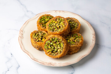 Traditional Turkish desserts; Kadaif stuffed with pistachios. Turkish name; Kadayif dolmasi or dolma kadayif. Halep sarma, halep sarmasi.