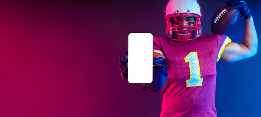 Sports Betting. American Football Player. Sports betting on american football. Bets in the mobile phone application. © Mike Orlov