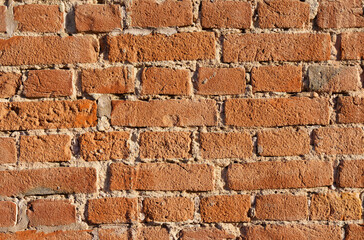 Texture of an old red brick wall.