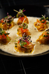 dumplings with caviar in a creamy sauce