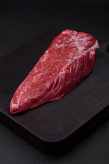 Beautiful fresh piece of raw beef on a wooden cutting board