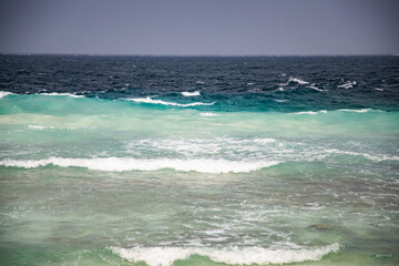 white waves on dark sea background