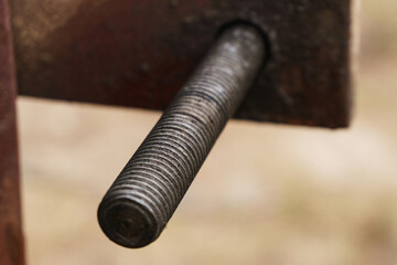 Screw lock on an old metal garage close-up.Reliability concept.