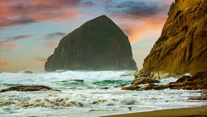 Heavy surf crashing on the Haystack rock and the beach at Pacific City on the Oregon coast © Bob