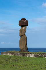 Side view of the moai of Ahu Ko Te Riku with headgear and eyes on Easter Island (Rapa Nui), Chile. The Ahu Ko Te Riku is the only ceremonial platform on Easter Island where you can see a complete moai