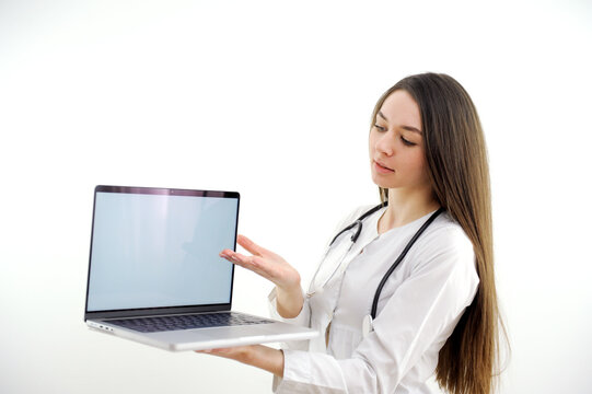 Doctor or nurse hold laptop computer in hands finger pointing digital screen isolated on a white background. High quality photo