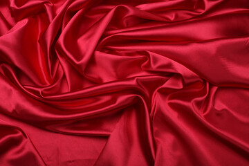 Red nacre wave fabric silk. Abstract texture horizontal copy space background.