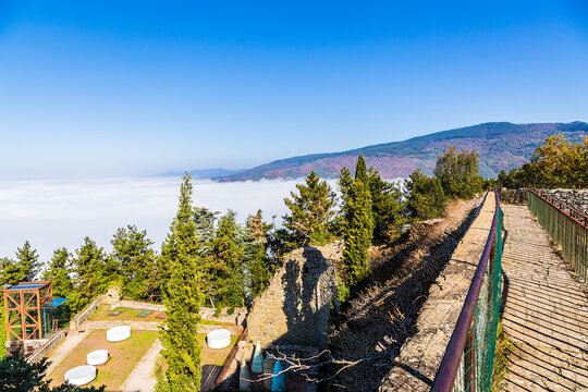 Cortona, Italy. Picturesque mountain landscape from the wall of the Girifalco fortress: above the clouds